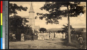 People departing a stone church after Mass, Congo, ca.1920-1940