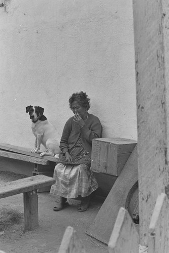 Filipino woman with dog, from Walnut Grove: Portrait of A Town