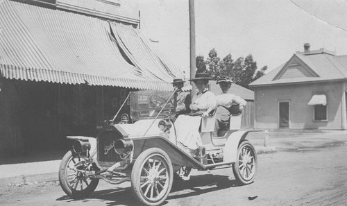 Kellar E. Watson, his wife, Alice, and Aunt Nan ride in Mr. Watson's 1909 Model 10 Buick, Orange, California, 1909