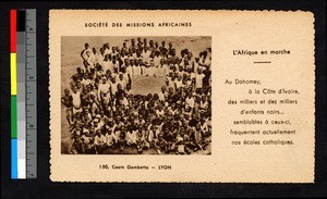 Catholic school children standing with sign, Benin, ca.1920-1940
