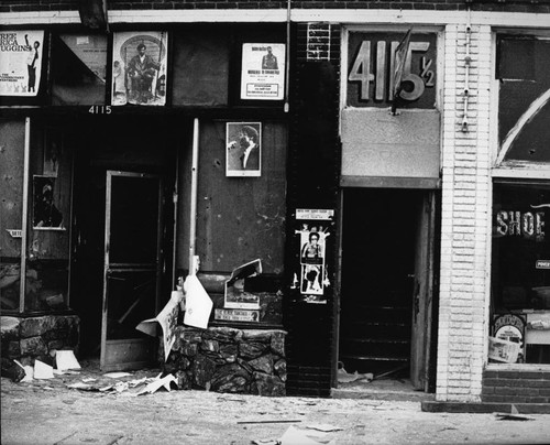 Damaged Black Panthers office exterior after a raid, Los Angeles, 1969