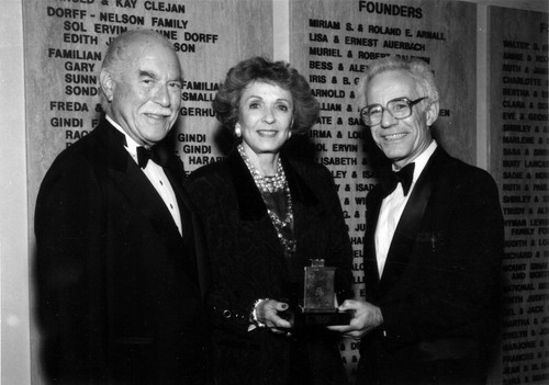 Mr. and Mrs. Isadore Familian receive an award from Dr. David Lieber