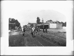 Workmen laying rails for the Los Angeles and Agricultural Park street cars on Main Street near Third Street, ca.1886