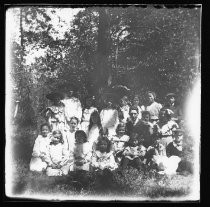 Group portrait, sitting outdoors