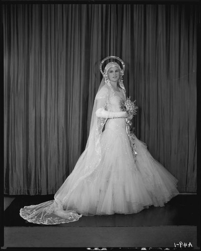 Peggy Hamilton modeling an Earl Luck wedding dress, 1931