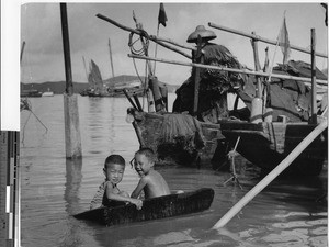 Young boys playing in water of Hong Kong, China, ca.1940