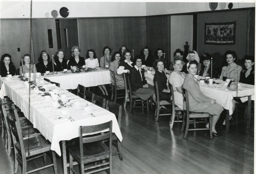 Women's dinner--Margaret Brown, later Houser seated at front on left side of table