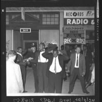 Three suspects being taken into custody after riot between "Muslim" sect and police in Los Angeles, Calif., 1962