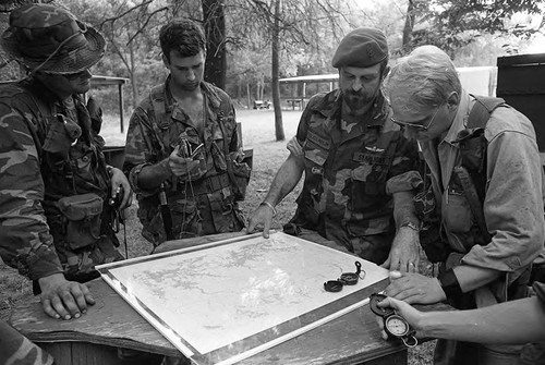 Survival school students look at a map, Liberal, 1982