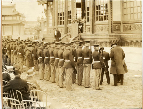 [A. H. Duke, Siamese Commissioner General, addressing U. S. Marines in front of the Pavilion of Siam at the Panama-Pacific International Exposition]