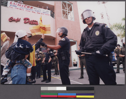 Police standing in front of Hi Tek store