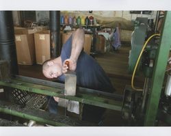 Russell Strickland working on a braiding machine, Sunset Line & Twine Company in Petaluma, California, Dec. 5, 2006