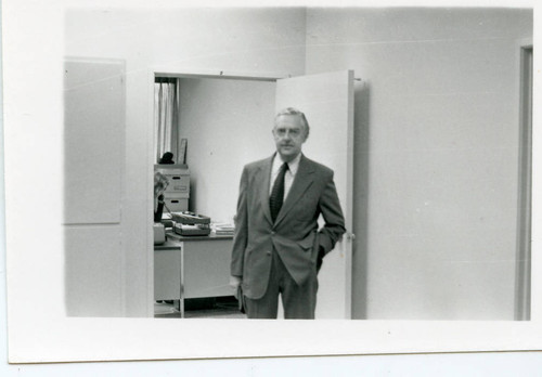 Dr. Tegner standing at the door of his office (Pose 2)