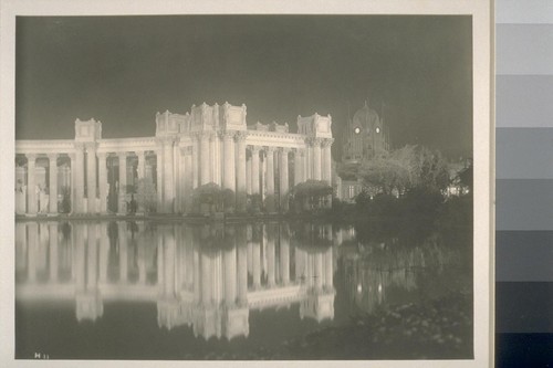 H11. [Colonnade, Palace of Fine Arts (Bernard R. Maybeck, architect), illuminated. Dome of the Netherlands Pavilion in background.]