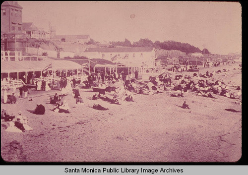 Santa Monica beach and the Arcadia Hotel with three flags: Canadian, English and American