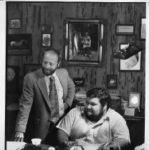 Ken Fontaine seated with his partner Ron Johnson in the Merchant's Exchange business