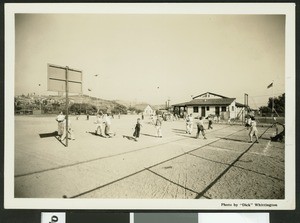 Boys playing basketball at a Los Angeles park, ca.1940