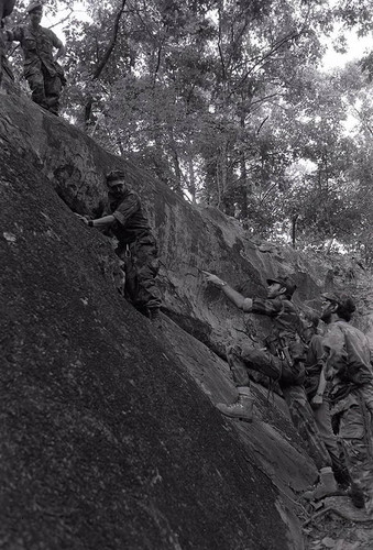 Survival school students learn to rock climb, Liberal, 1982