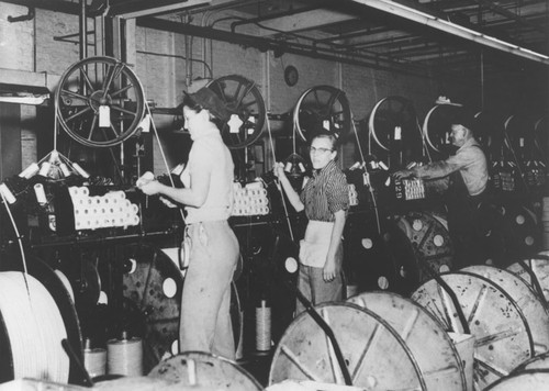 Anaconda Wire and Cable Company mill interior with workers, 1950