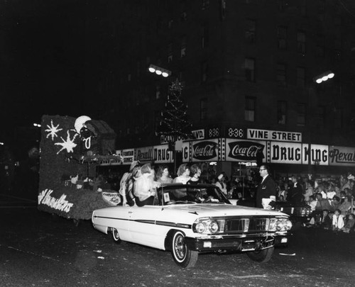 Car and float in Christmas parade