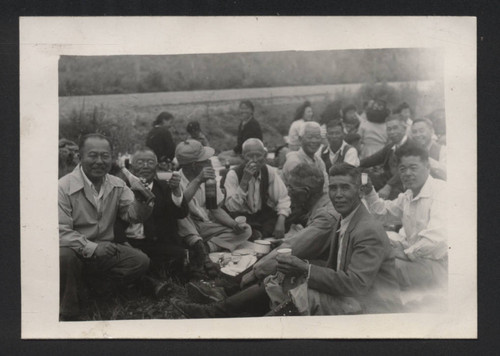 Elderly men at a picnic