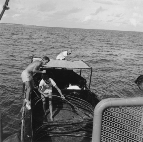 Willard Bascom winds cable on a DUKW amphibious vehicle, Capricorn Expedition