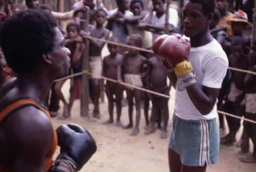 Boxers fighting inside boxing ring, San Basilio de Palenque, 1976
