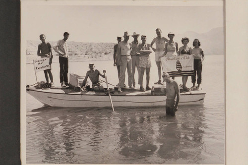 Group of the Mexican Hat Expeditions at Pierces Ferry where they are posed on the "Esmeralda II" which they had picked up on the beach at Mile 120 after she had been cut loose by Hudson