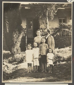 Missionary Gutmann with family in front of house, Moshi, Tanzania, ca.1902-1914