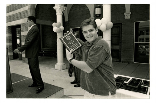 Gregory Duval Holding an Award at the 1993 Woodbury University Awards Convocation
