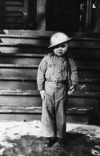 Young boy dressed in soldier costume