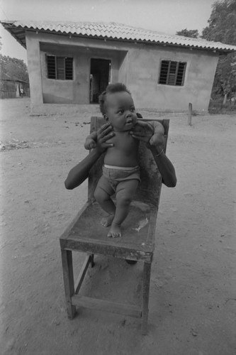 Baby standing on chair, San Basilio de Palenque, ca. 1978