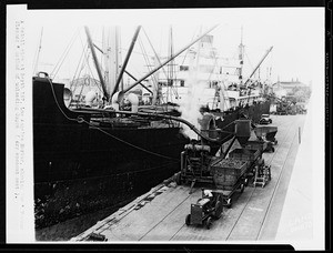 Detail view of Berth #187 showing the "vacuum cleaner" method of unloading copra, dry coconut meat, in Los Angeles Harbor