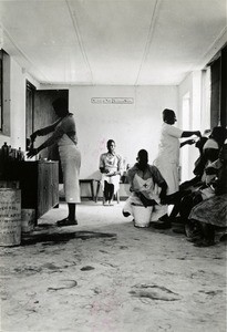 In Lukona, patients and native nurses in a consultation room