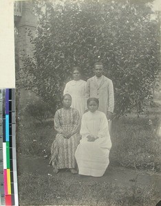 Three Malagasy women and one man in a garden, Madagascar