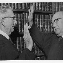 Oscar A. Kistle, left, being sworn in as a Superior Court judge by Judge Albert H. Mundt