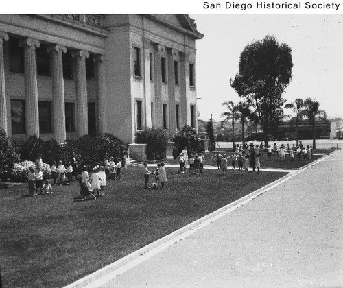 Children playing on the lawn in front of San Diego State Normal School