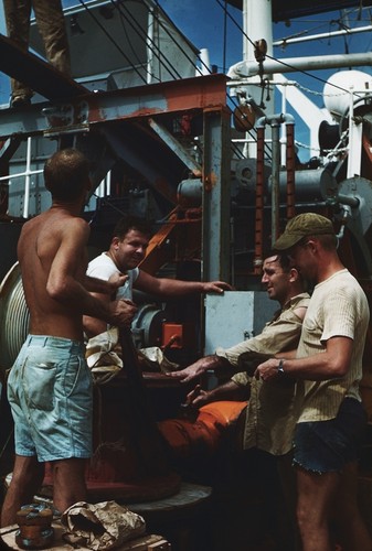 Four men on deck with winch