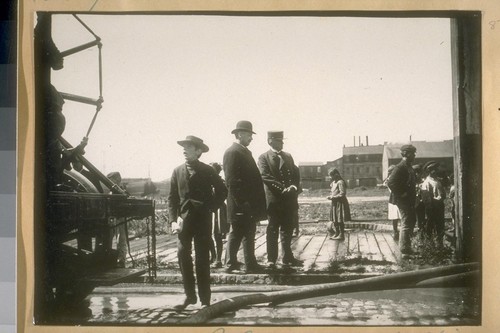 Chief D. Sullivan, S.F. [San Francisco] Fire Dept. and Chief O'Connell of Buffalo, New York Fire Dept. on Bay St., 1914, testing a Water Tower