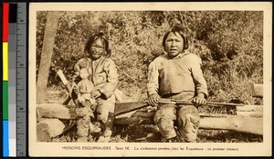 Children holding a rifle and a doll, Canada, ca.1920-1940