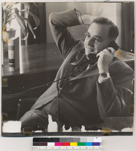Edmund G. Brown with a telephone
