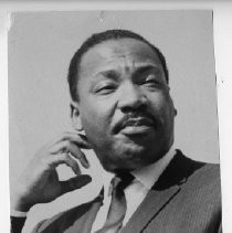 Dr. Martin Luther King, Jr. Here, a closeup as he addresses a crowd in the Sacramento State College stadium