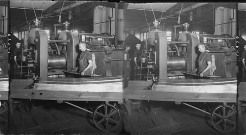 "Breaking down" - the first process in rolling brass bars into sheets, Bridgeport, Conn