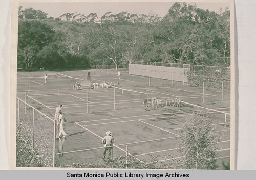 People at a tennis court at Uplifter Ranch clubhouse in Rustic Canyon, Calif