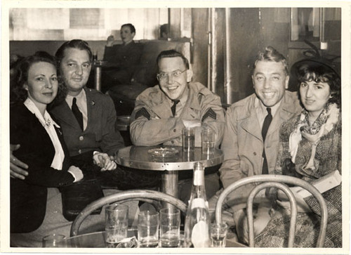 [Five people sitting at a table in Finocchio's nightclub]