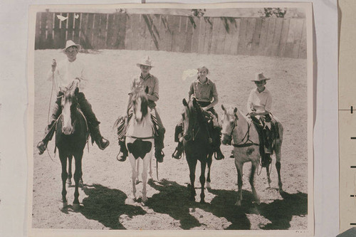 Will Rogers Family (left to right Will Sr., Mary, Jim, and Will Jr.) riding and roping at the Tan Bark Arena in Beverly Hills