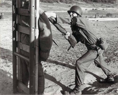 Photograph of a soldier using a bayonet