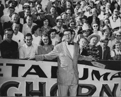 KGO sportscaster Ira Blue and crowd at a Leghorn-Bonecrusher game at Baily Field, Santa Rosa, California, Nov. 5, 1950