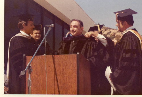 President Banowsky and Chancellor Young awarding Edward Teller with an honorary doctorate