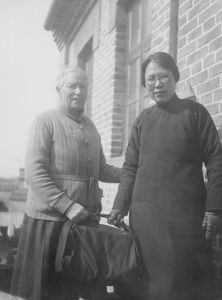 Ellen Nielsen and Miss. Ting on their way to a young Chinese teacher's engagement. In the red b